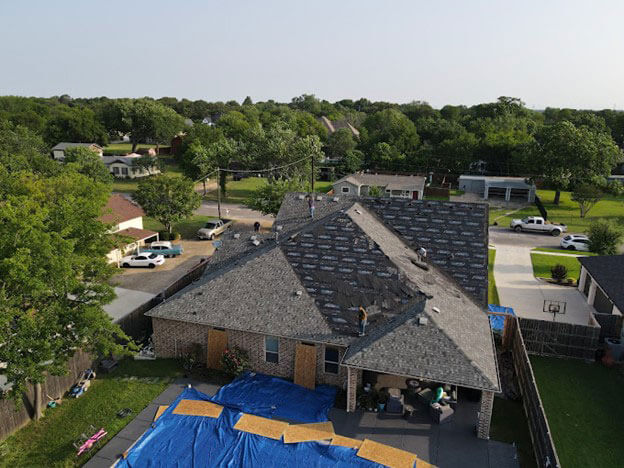 aerial view of roof work on home